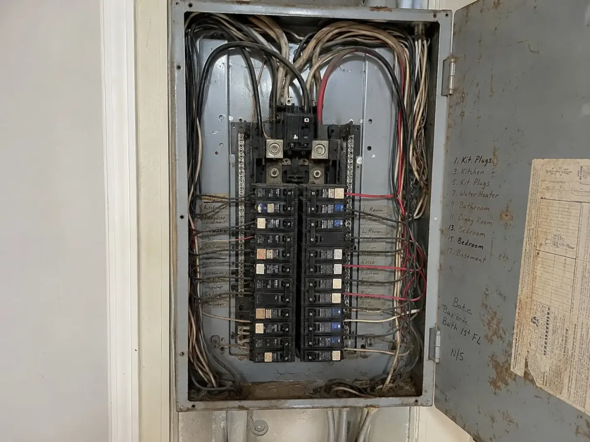 Outdated residential electrical panel before upgrade, example of Westside Comfort Solutions work