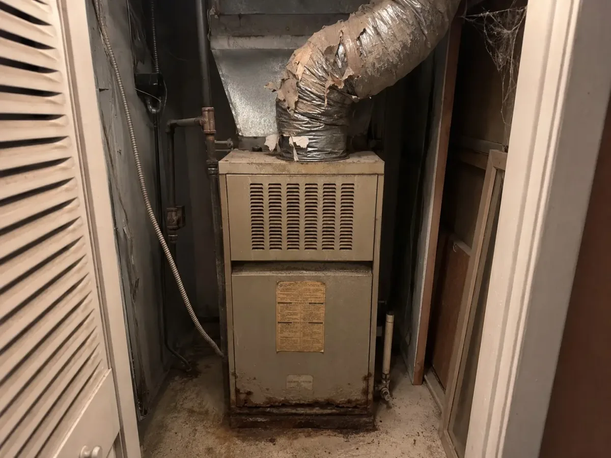 Aging residential furnace before replacement, example of Westside Comfort Solutions work