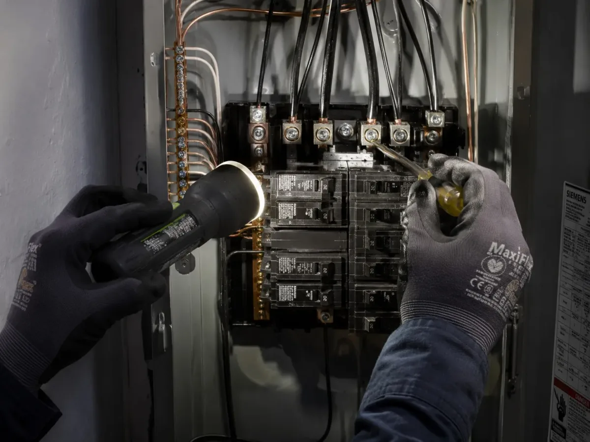 Westside Comfort Solutions electrician working on a residential electrical panel in Washington
